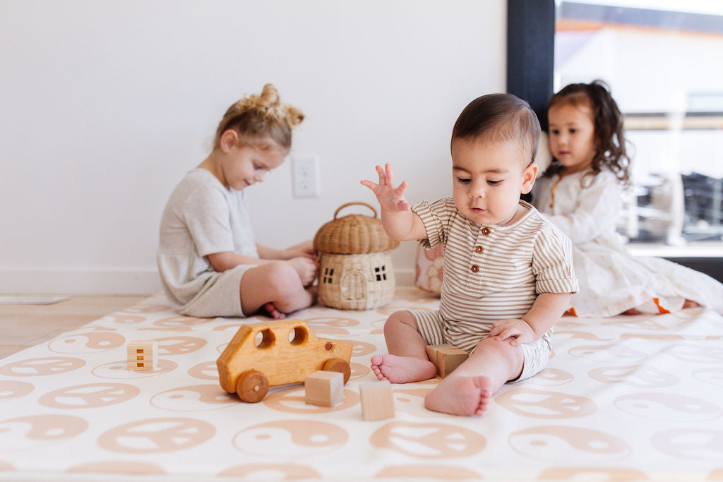 baby and toddlers playing on toki mats plat mat