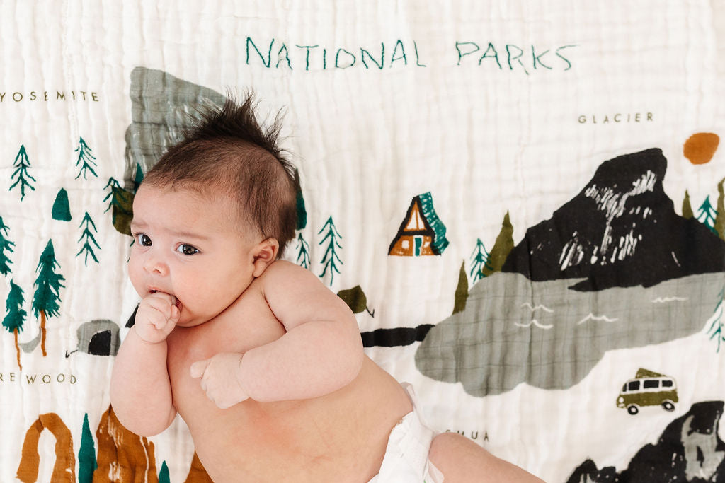baby laying on a blanket