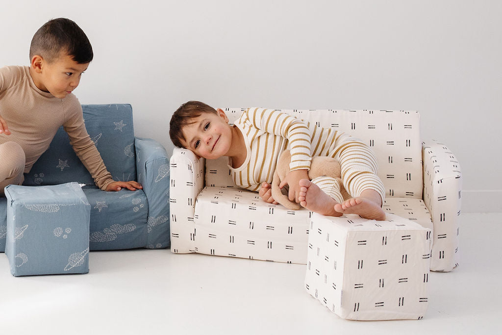 kids laying on toki mats play couches