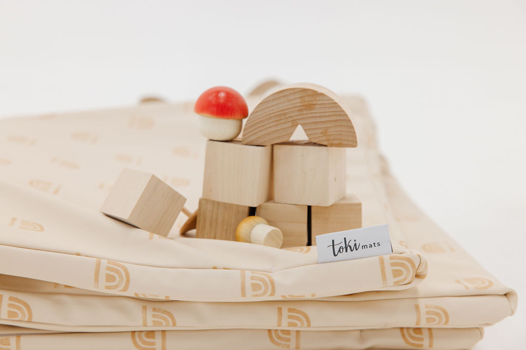 a folded toki mats play mat with toys on it