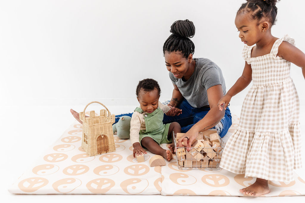 family playing on toki mats play mat